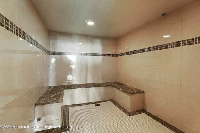 a view of room with stairs and a rug