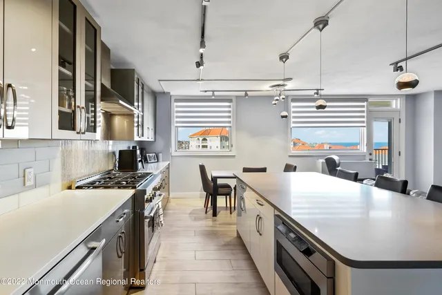 a kitchen with a stove and a refrigerator