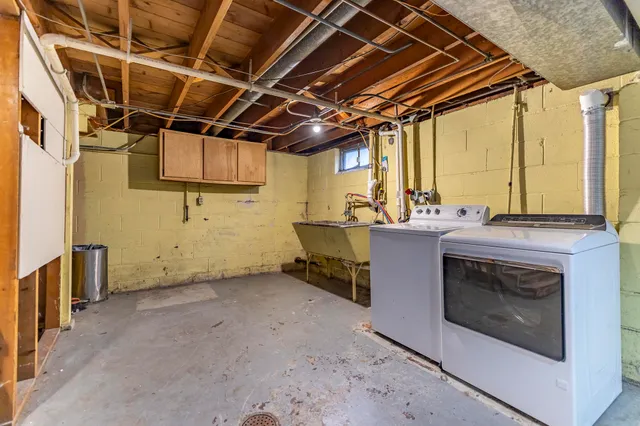 a view of an empty room with wooden shelves