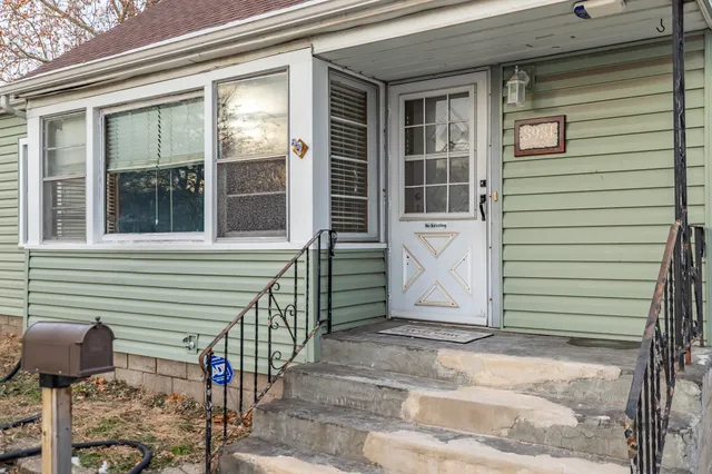 a front view of a house with a garage