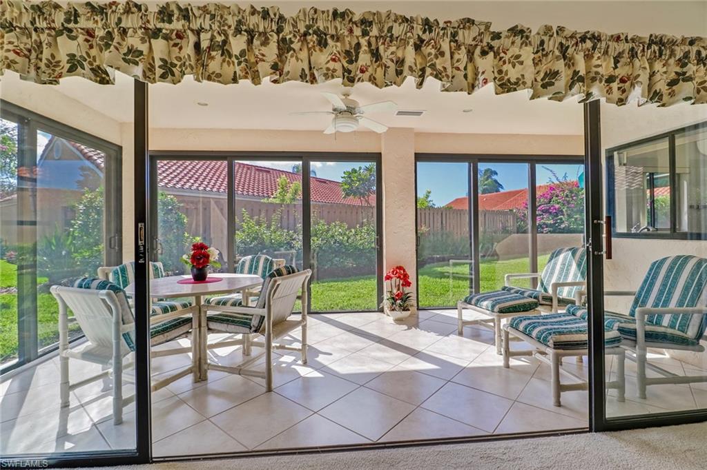 805 Reef Point Circle Naples, FL 34108 - Photo 12 of 33 a view of a patio with a table chairs and backyard