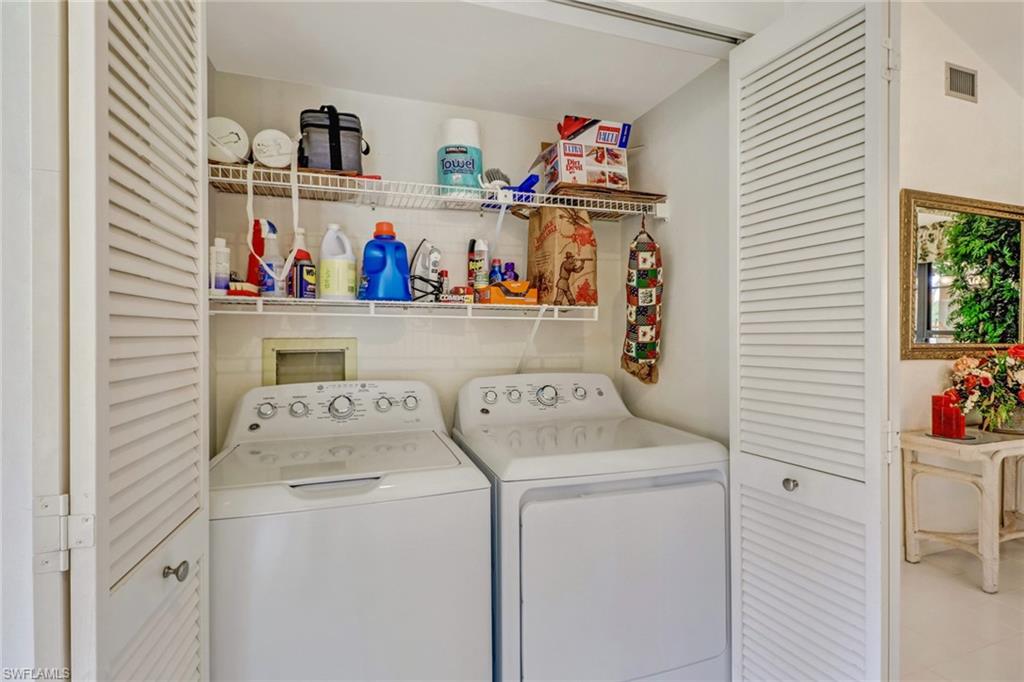 805 Reef Point Circle Naples, FL 34108 - Photo 16 of 33 a utility room with dryer and washer