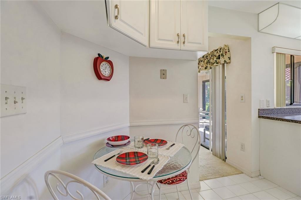 805 Reef Point Circle Naples, FL 34108 - Photo 18 of 33 a view of a dining room with furniture