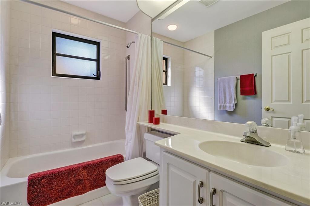 805 Reef Point Circle Naples, FL 34108 - Photo 21 of 33 a bathroom with a sink toilet and shower