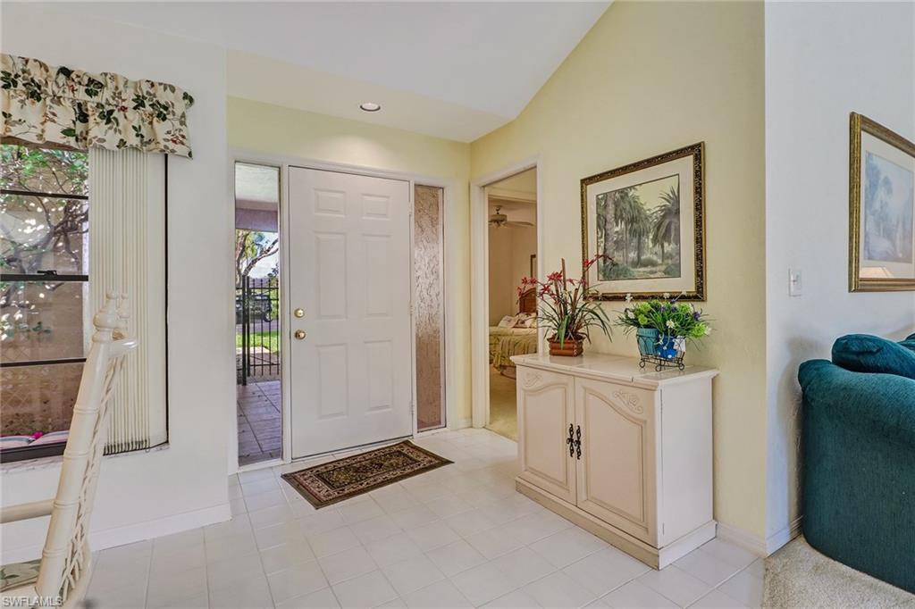 805 Reef Point Circle Naples, FL 34108 - Photo 4 of 33 a view of kitchen with furniture and refrigerator