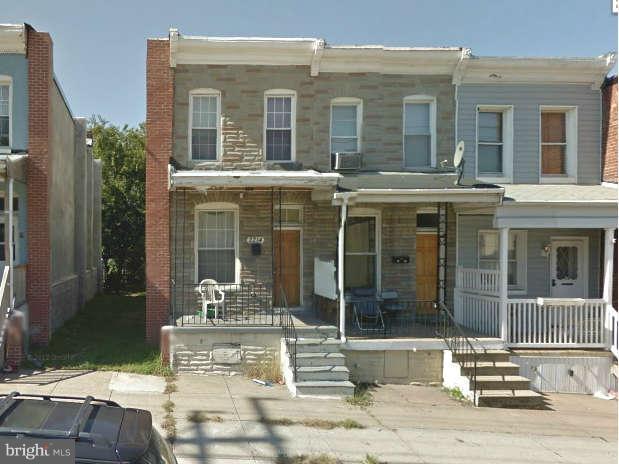 2214 Annapolis Road Baltimore, MD 21230 - Photo 1 of 1 front view of a brick house with a large window