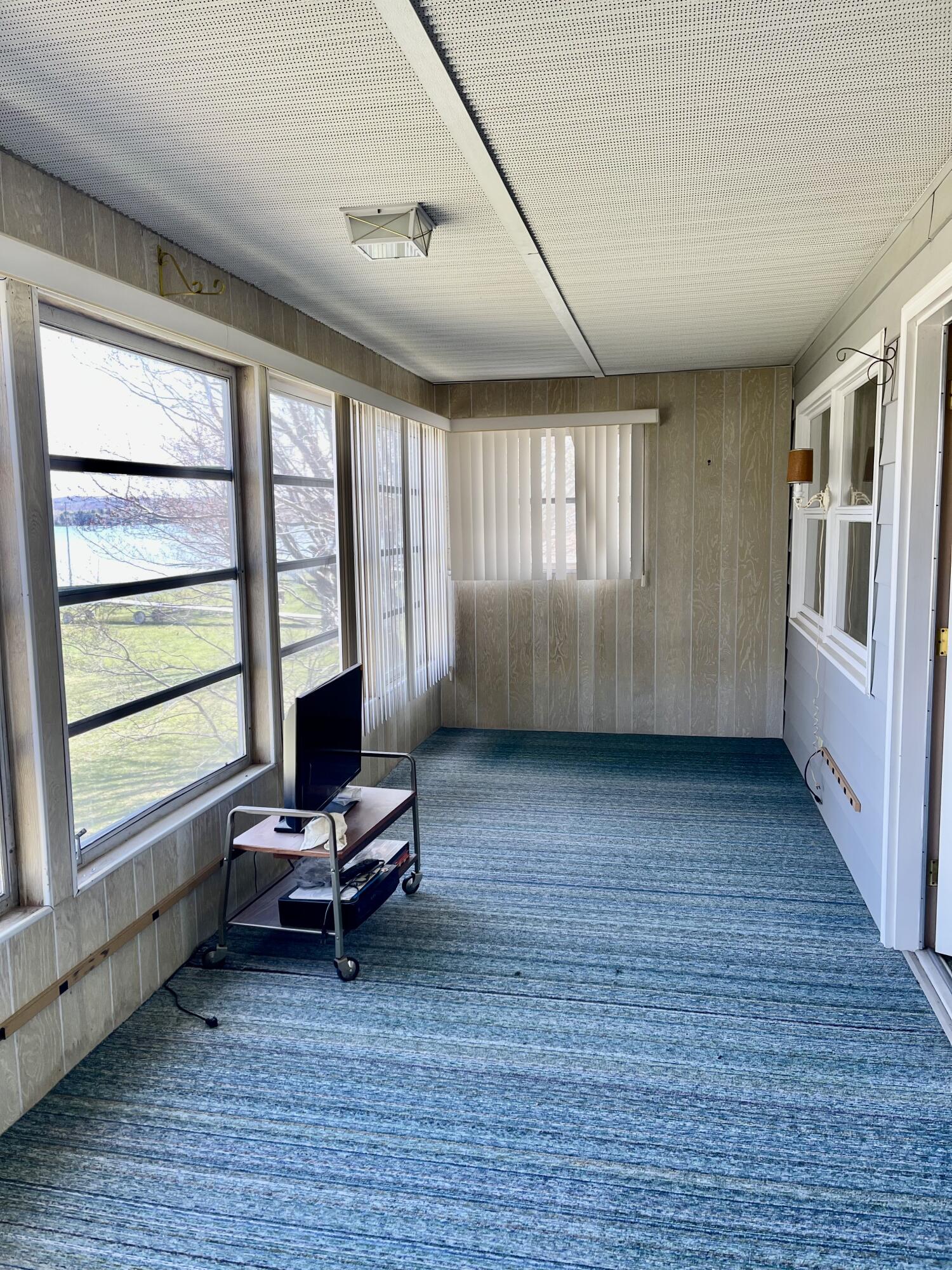 8703 Bayview Road Onekama, MI 49675 - Photo 14 of 25 Upper Sunroom