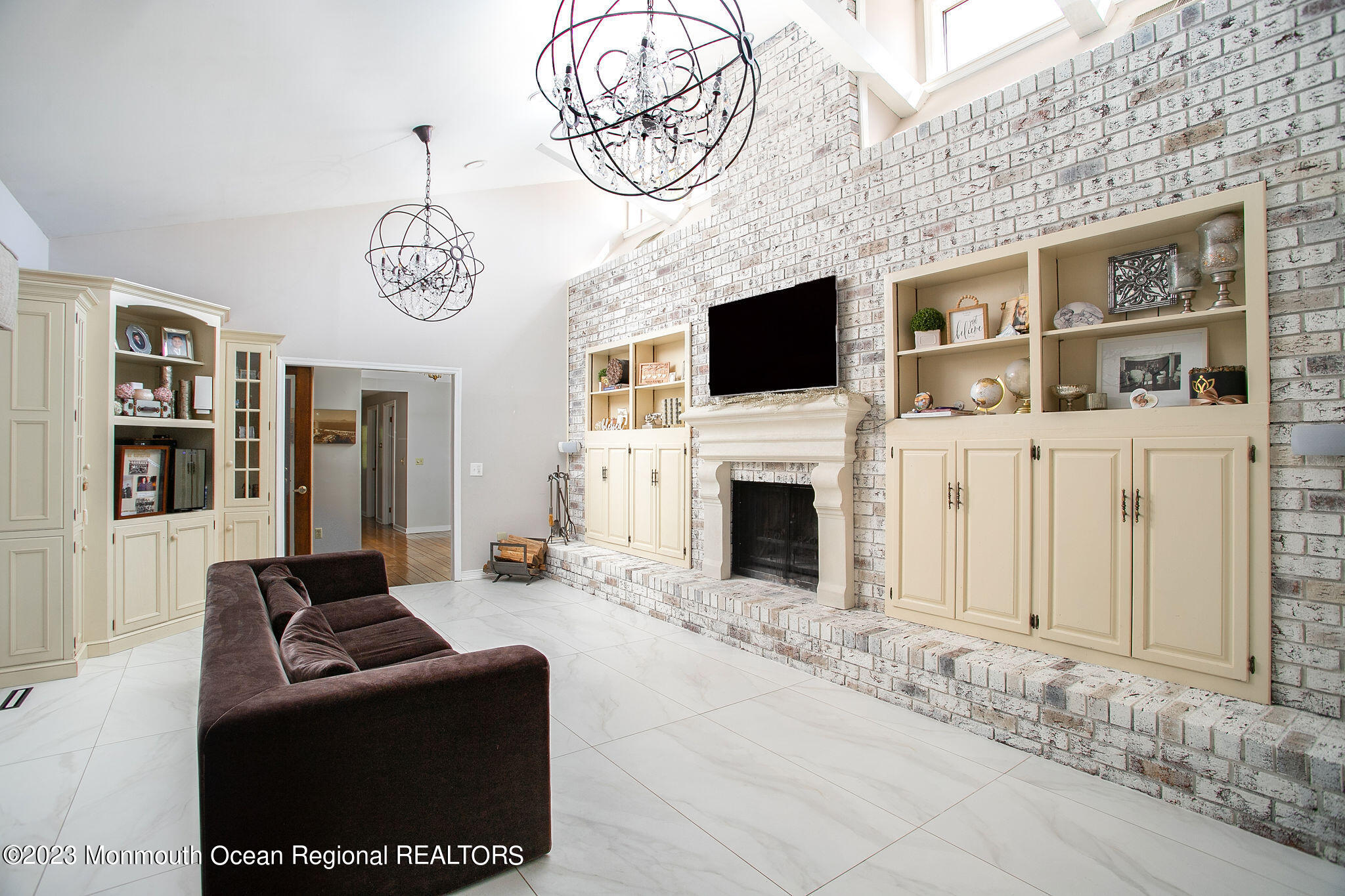9 Laurel Drive Wrightstown, NJ 08562 - Photo 9 of 66 a living room with furniture a fireplace and a flat screen tv