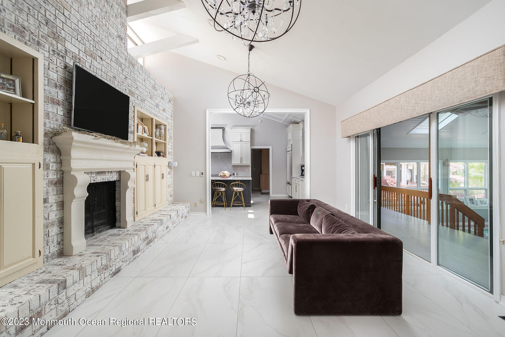 9 Laurel Drive Wrightstown, NJ 08562 - Photo 10 of 66 a living room with furniture a fireplace and a flat screen tv