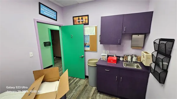 a room with cabinets and wooden floor
