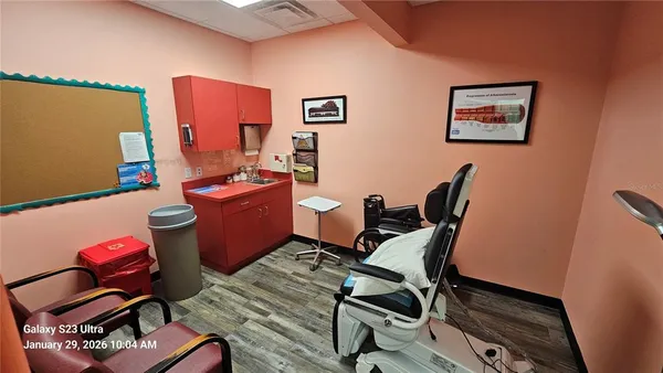 a work room with furniture and wooden floor