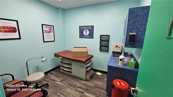 a work room with furniture and wooden floor