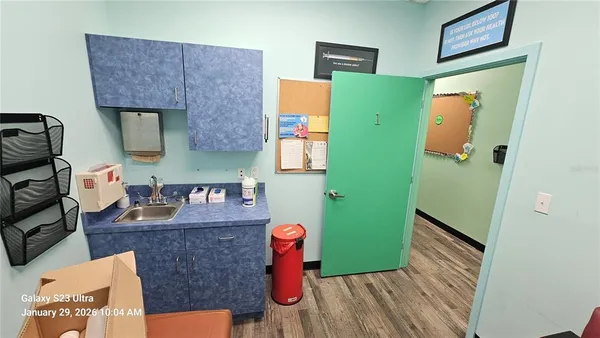 a bathroom with a sink mirror and vanity