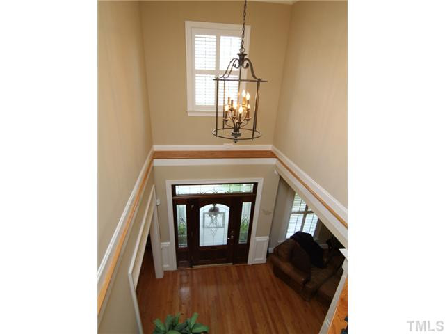 7305 Sparhawk Road Wake Forest, NC 27587 - Photo 3 of 25 DRAMATIC TWO STORY ENTRY FOYER IS VERY IMPRESSIVE AFTER PASSING THROUGH THE RELAXING ROCKING CHAIR" FRONT PORCH AND LEADED GLASS ENTRY WAY. Foyer