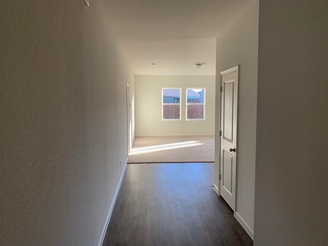 604 Indian Creek Anna, TX 75409 - Photo 2 of 12 a view of a room with wooden floor and a window