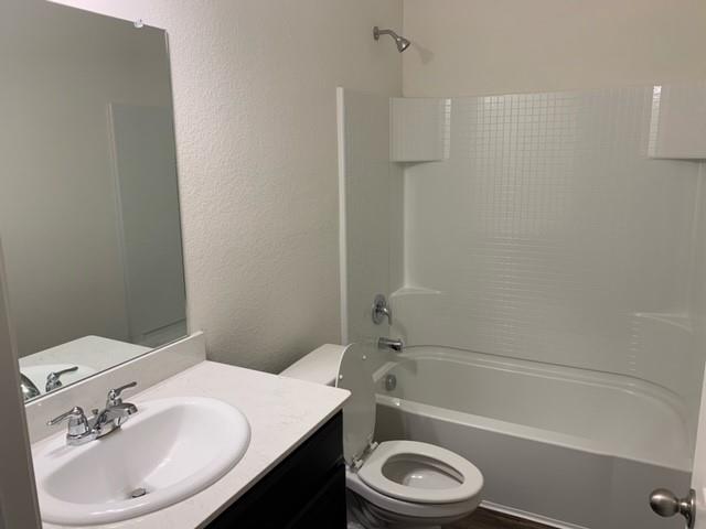 604 Indian Creek Anna, TX 75409 - Photo 10 of 12 a bathroom with a sink a toilet and a bathtub