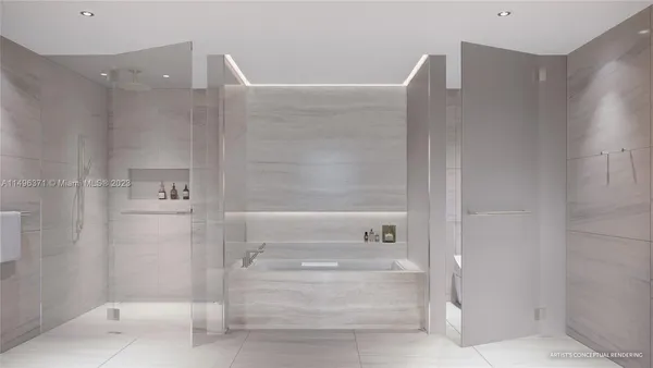 a en suite bathroom with a tub sink and mirror