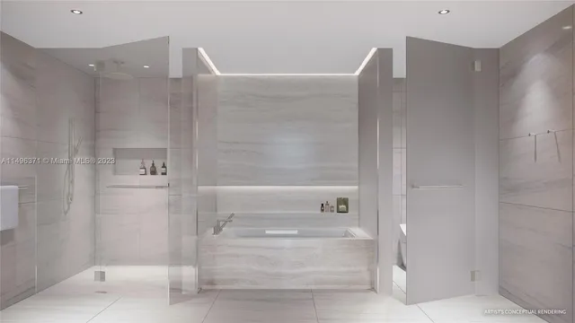 a en suite bathroom with a tub sink and mirror