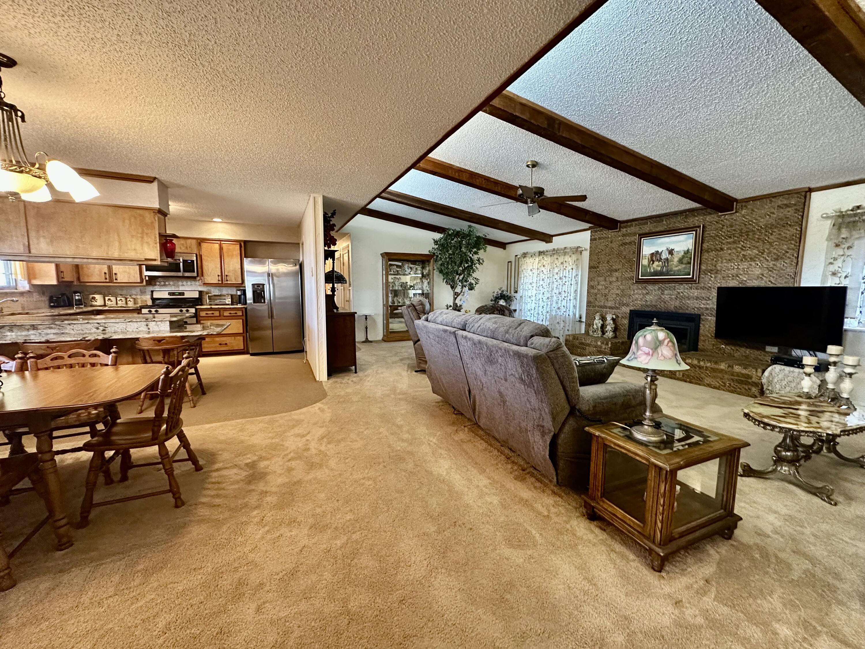 7844 Fm 1318 Tulia, TX 79088 - Photo 17 of 42 a living room with furniture and a flat screen tv