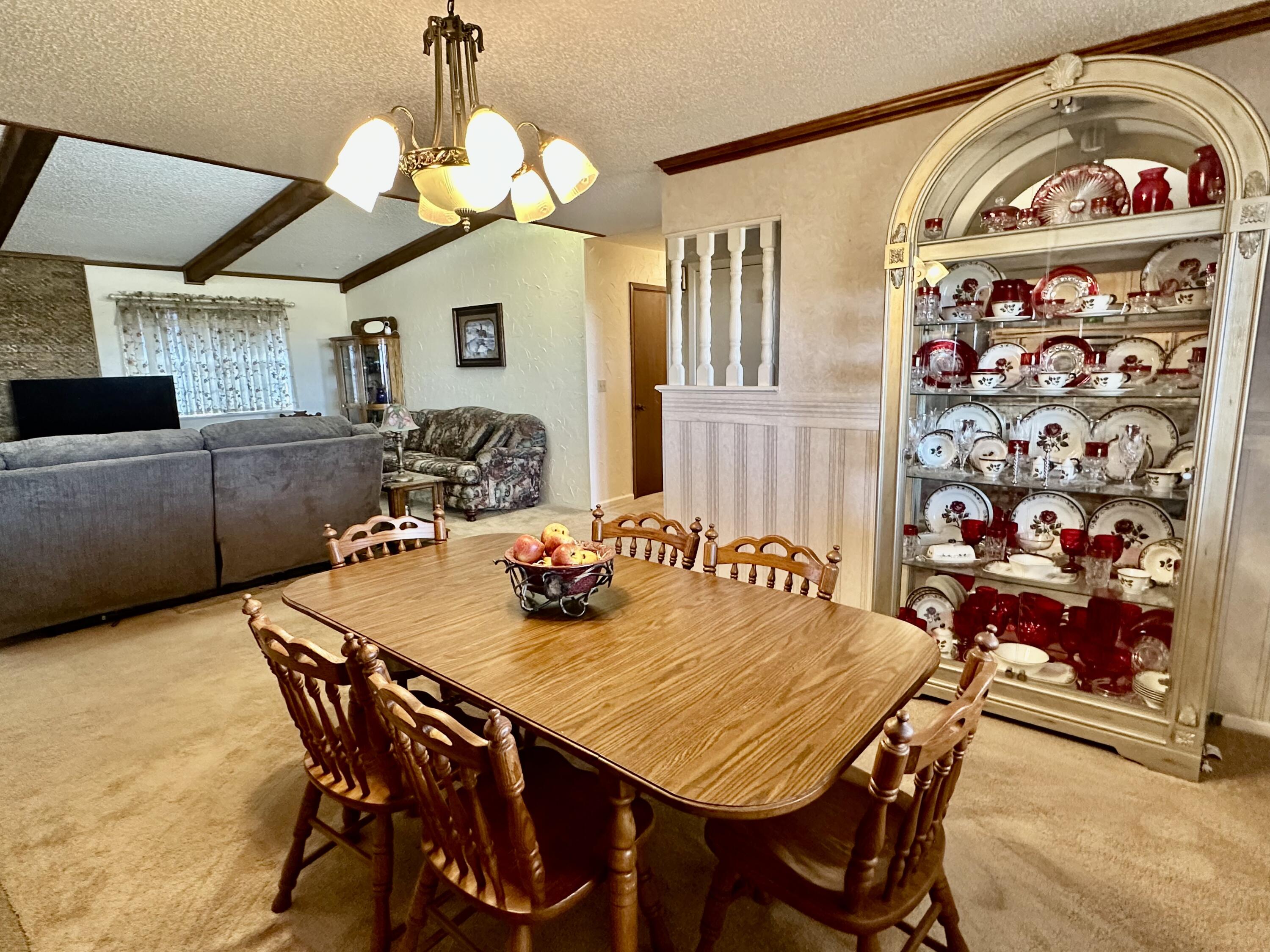 7844 Fm 1318 Tulia, TX 79088 - Photo 21 of 42 a view of a dining room with furniture and chandelier