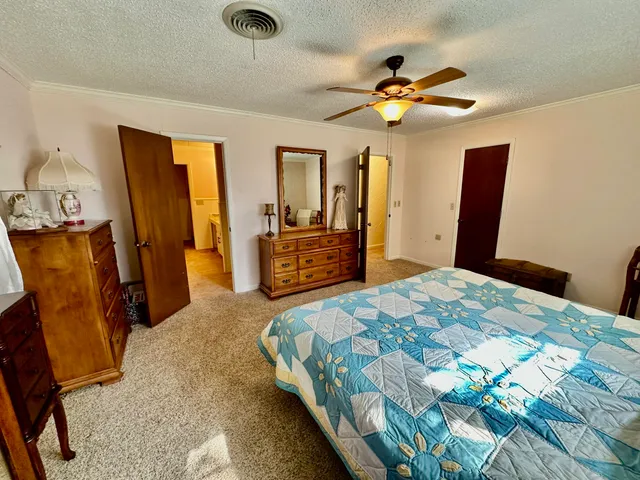 a spacious bathroom with a granite countertop sink mirror and a