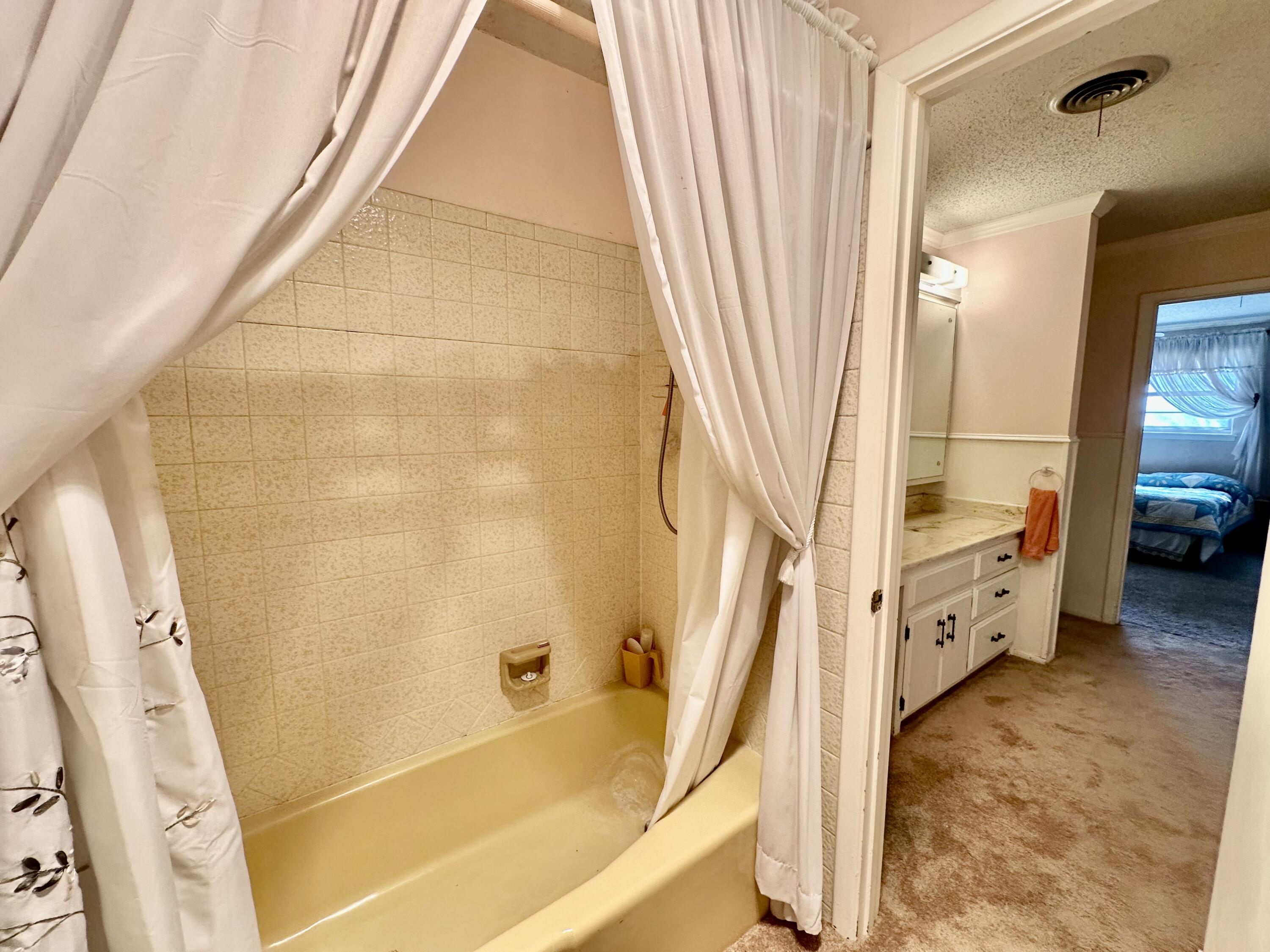 7844 Fm 1318 Tulia, TX 79088 - Photo 27 of 42 a bathroom with a tub and shower