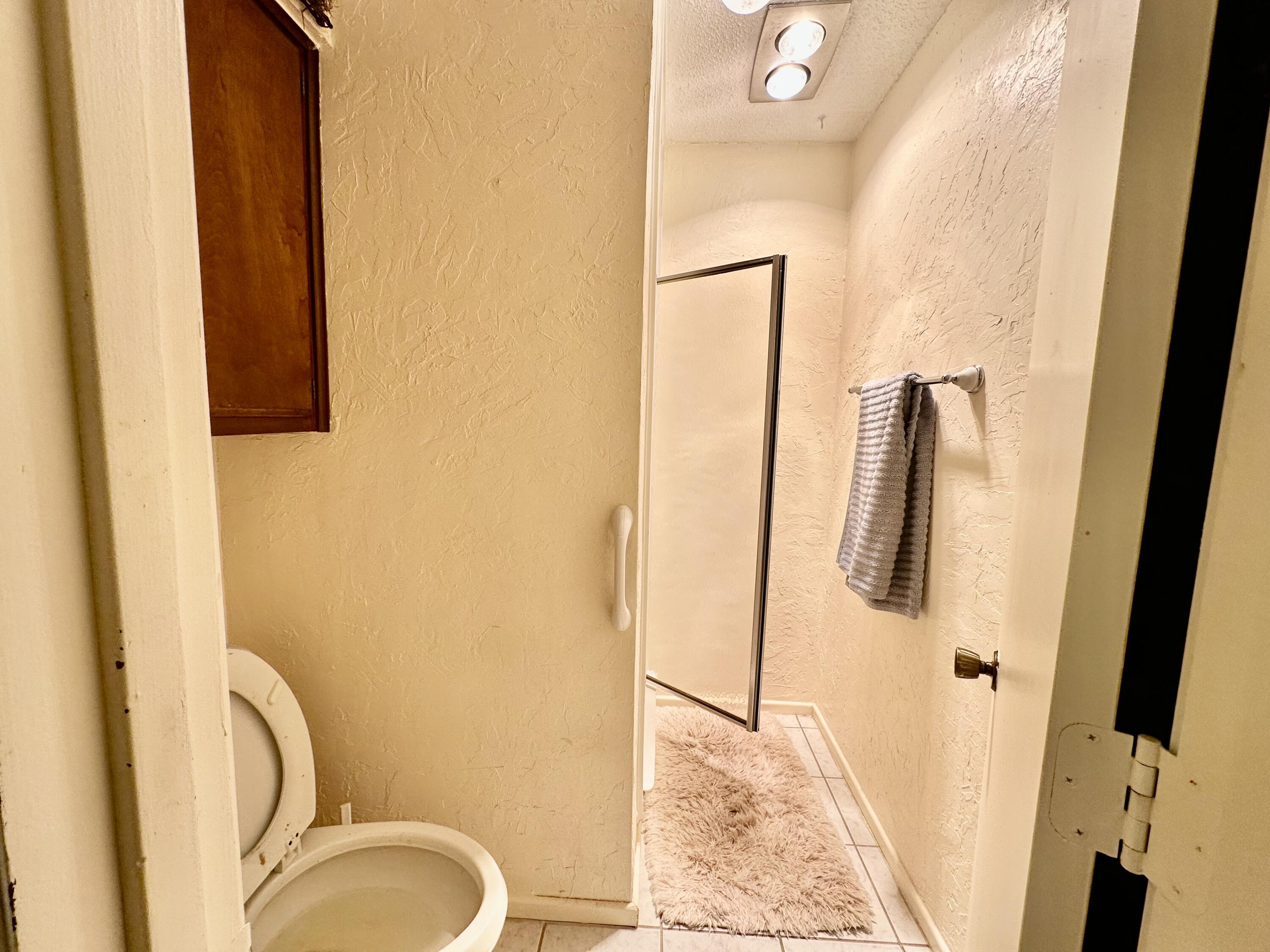 7844 Fm 1318 Tulia, TX 79088 - Photo 31 of 42 a bathroom with a granite countertop sink and a mirror