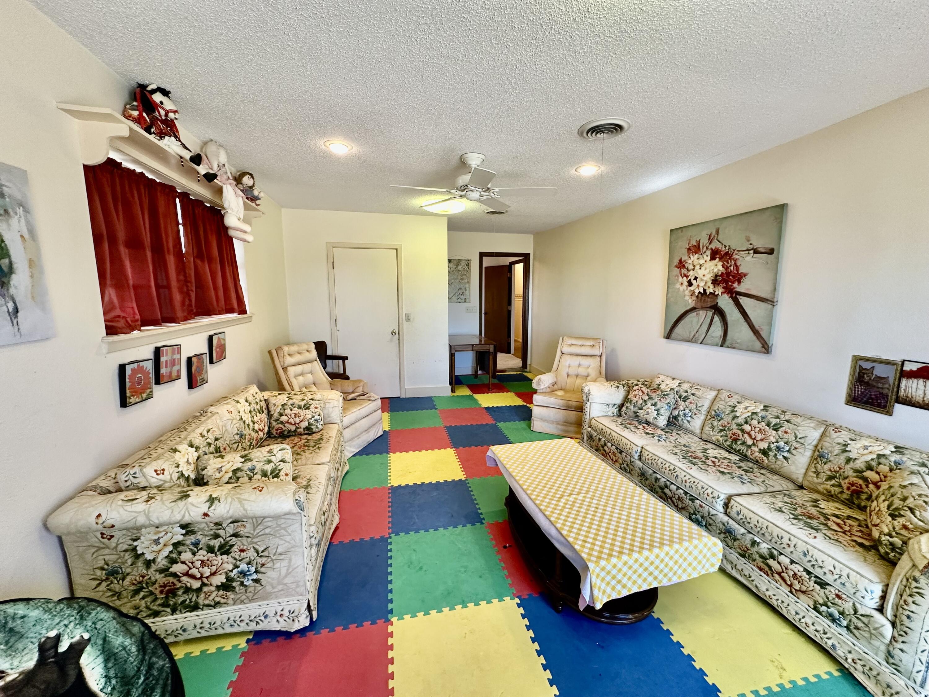 7844 Fm 1318 Tulia, TX 79088 - Photo 37 of 42 a living room with furniture fireplace and flat screen tv