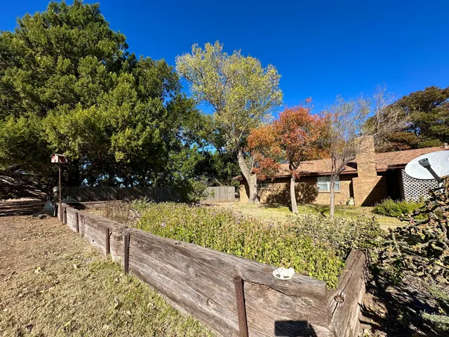 a view of a backyard of the house