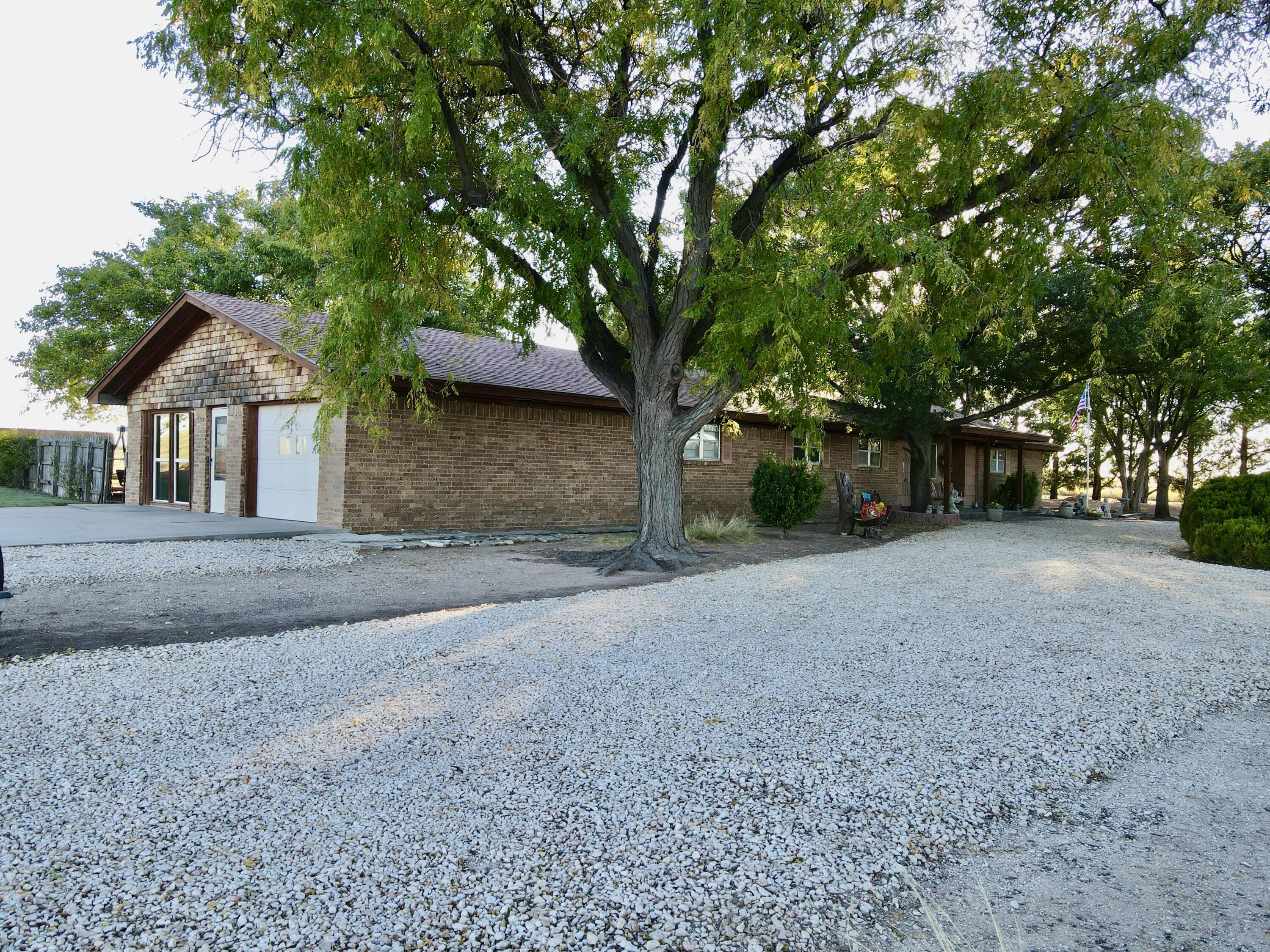 7844 Fm 1318 Tulia, TX 79088 - Photo 10 of 42 a view of a house with a tree