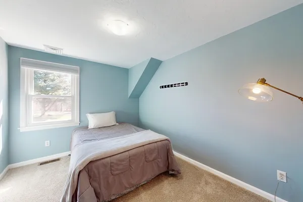 a view of a chairs and table in patio