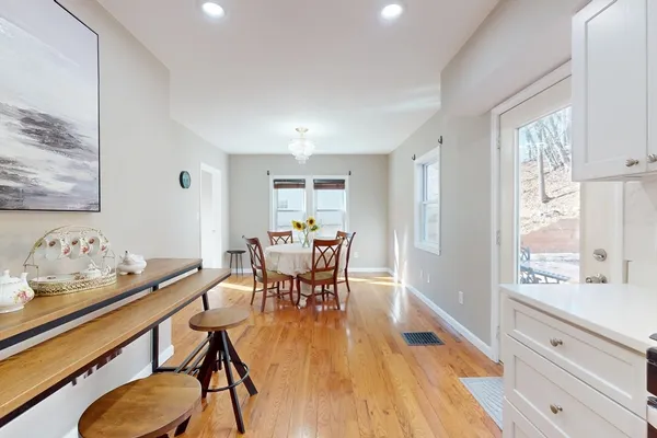 a front view of a house with a yard garage and outdoor seating