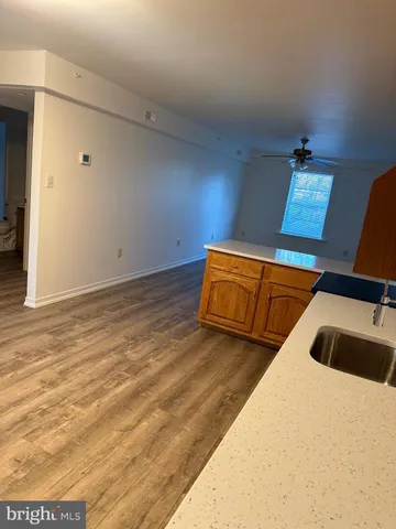 a view of a room with wooden floor