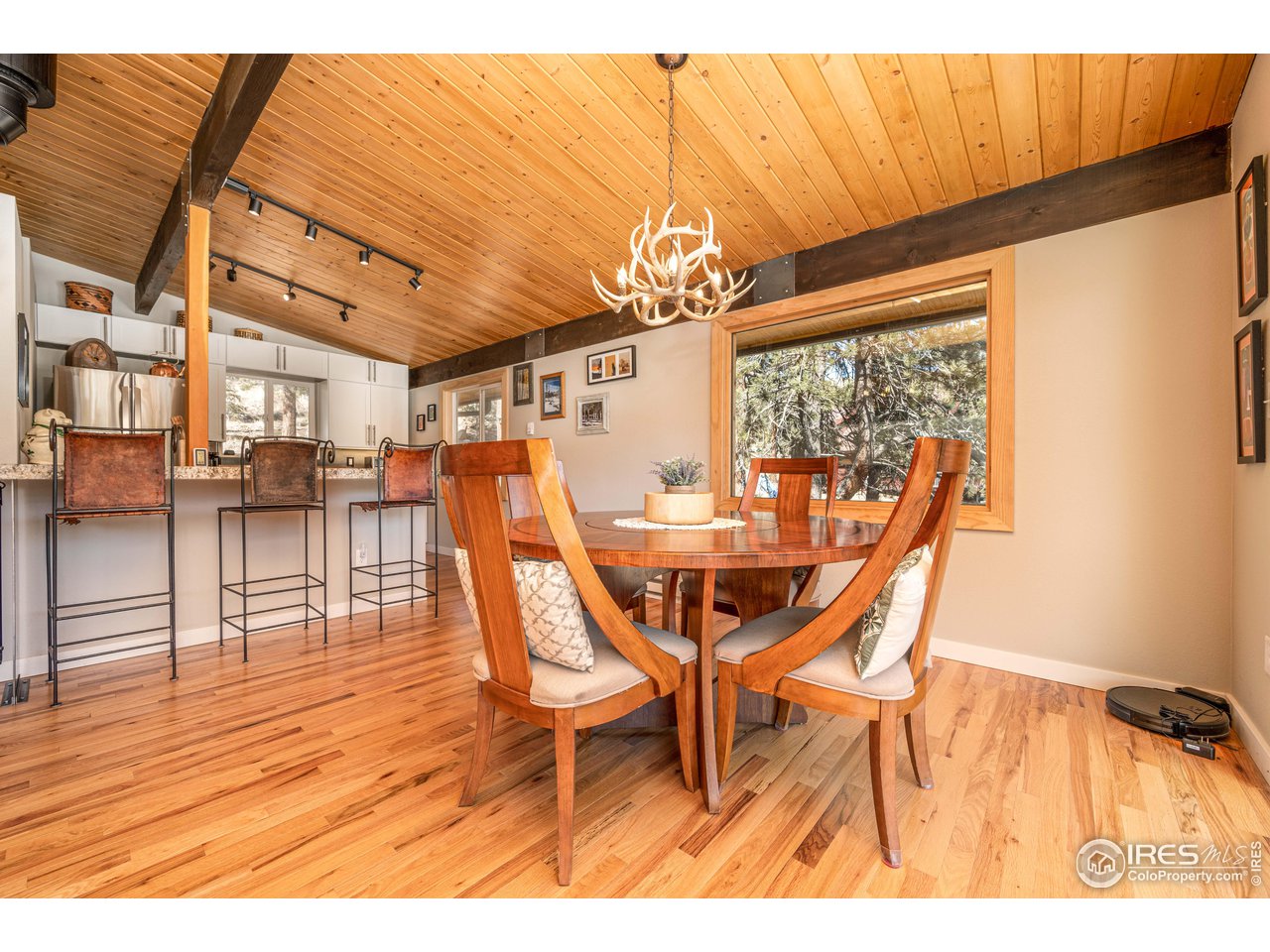 245 Hemlock Drive Lyons, CO 80540 - Photo 12 of 34 a view of a dining room with furniture and wooden floor