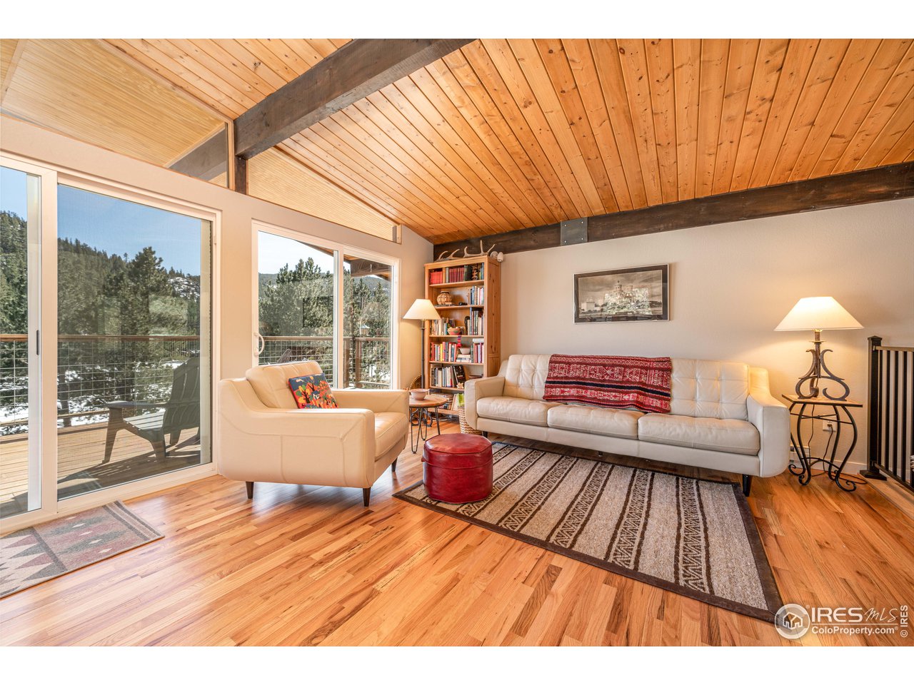 245 Hemlock Drive Lyons, CO 80540 - Photo 13 of 34 a living room with furniture and a wooden floor