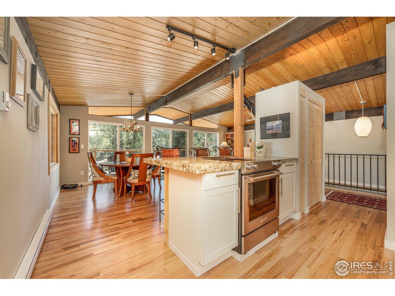 245 Hemlock Drive Lyons, CO 80540 - Photo 15 of 34 a view of kitchen with furniture and wooden floor