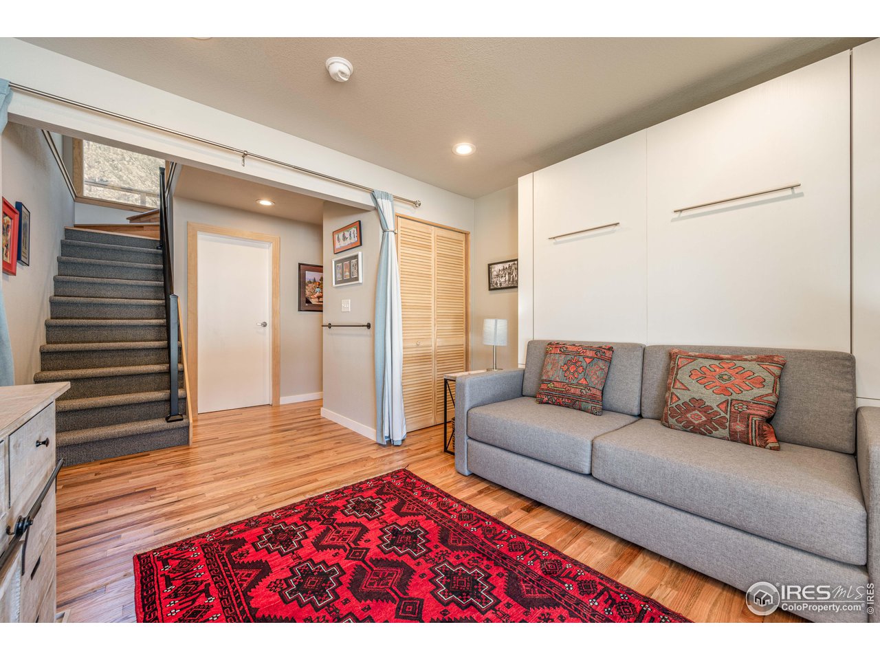 245 Hemlock Drive Lyons, CO 80540 - Photo 20 of 34 a living room with furniture and a wooden floor