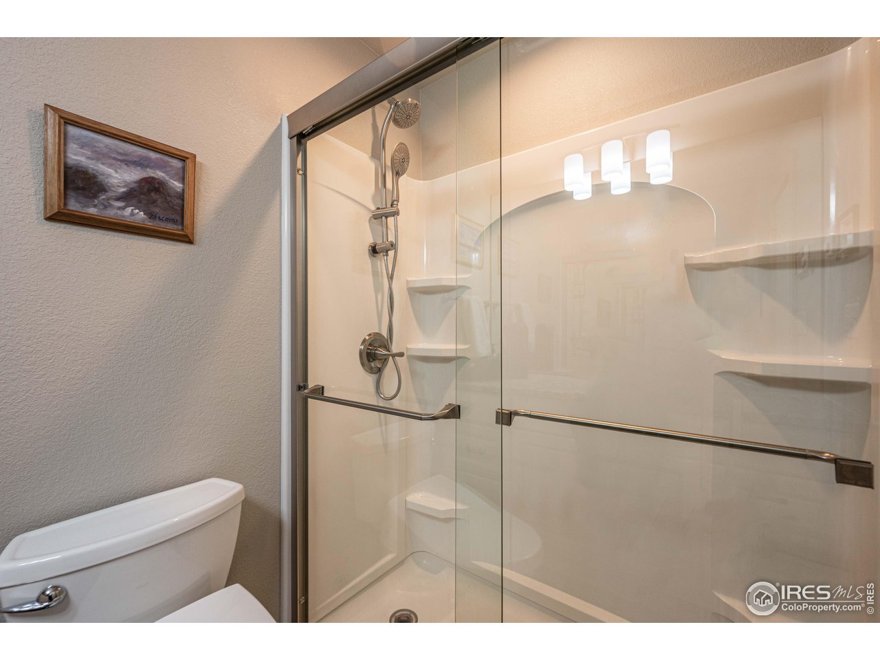 245 Hemlock Drive Lyons, CO 80540 - Photo 23 of 34 a bathroom with a shower and a toilet