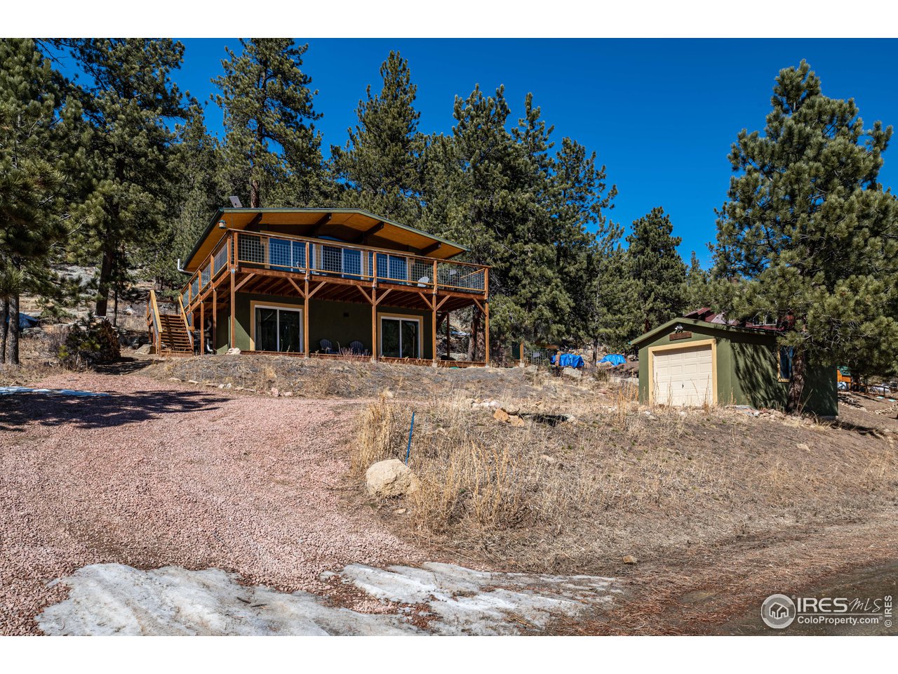 245 Hemlock Drive Lyons, CO 80540 - Photo 27 of 34 a view of a yard with a house in the background