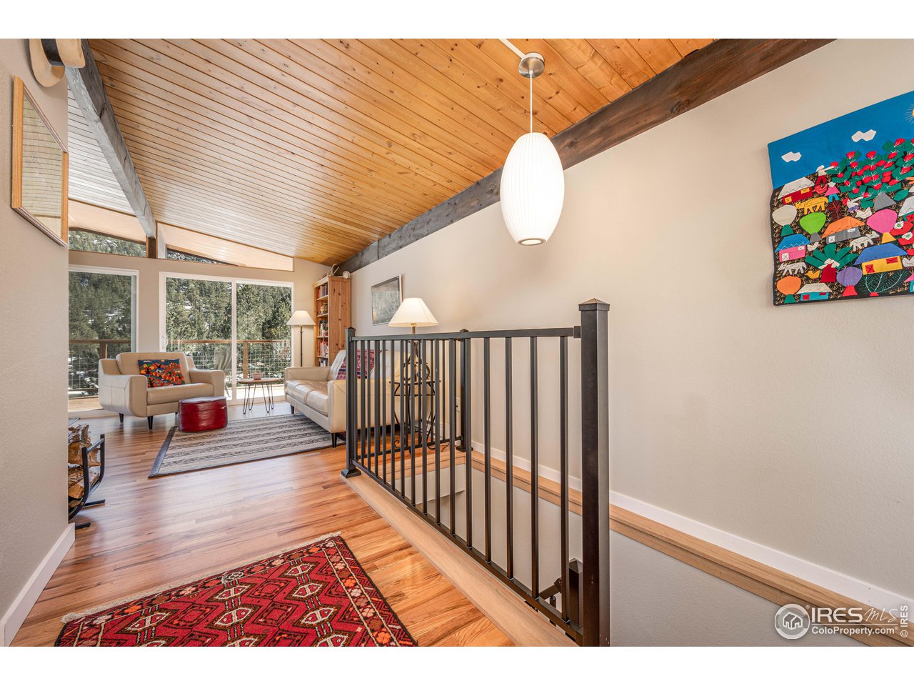 245 Hemlock Drive Lyons, CO 80540 - Photo 3 of 34 a view interior of a house with wooden floor and windows