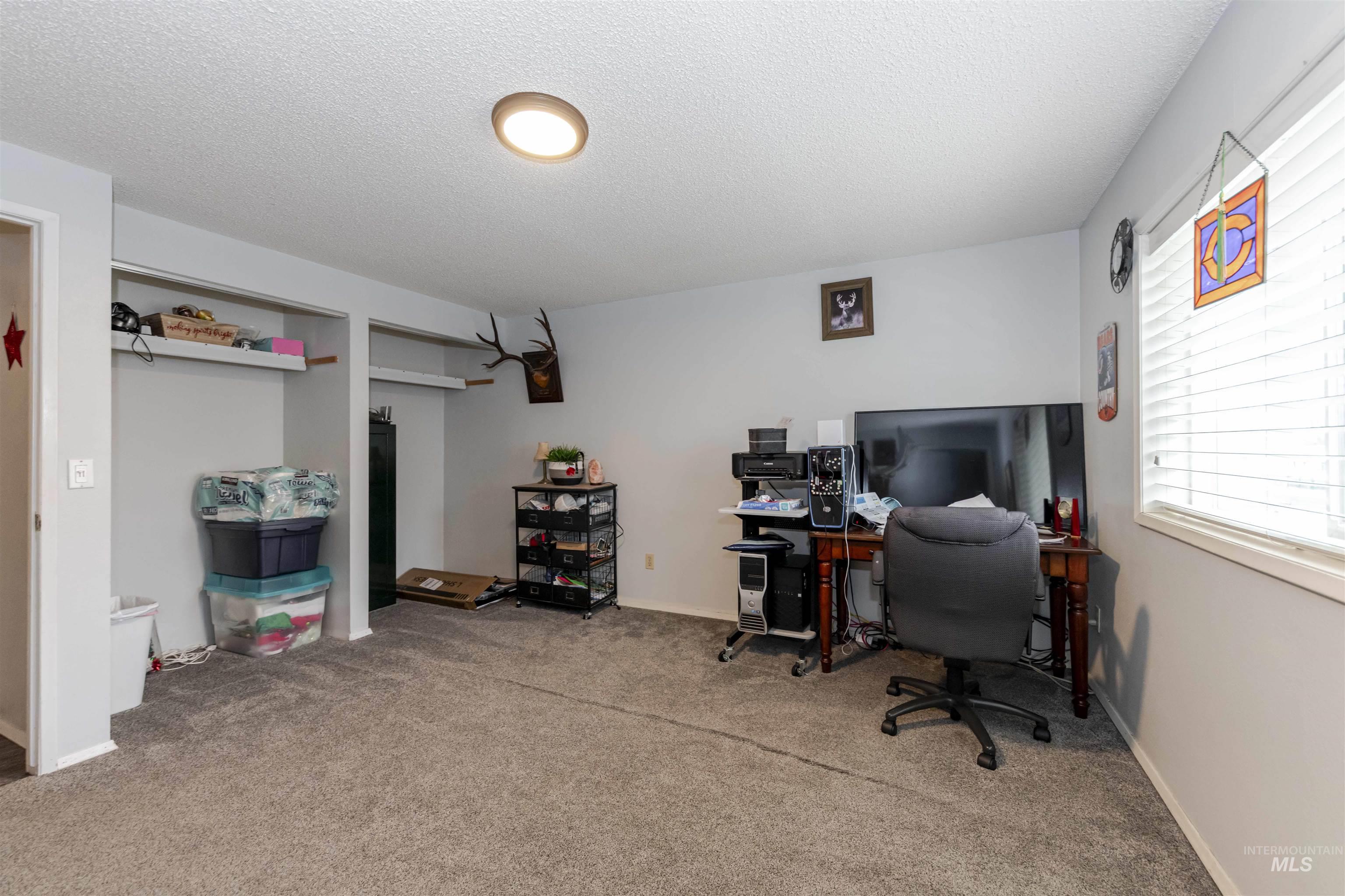 930 Preston Avenue Lewiston, ID 83501 - Photo 10 of 32 Office with a textured ceiling and light carpet