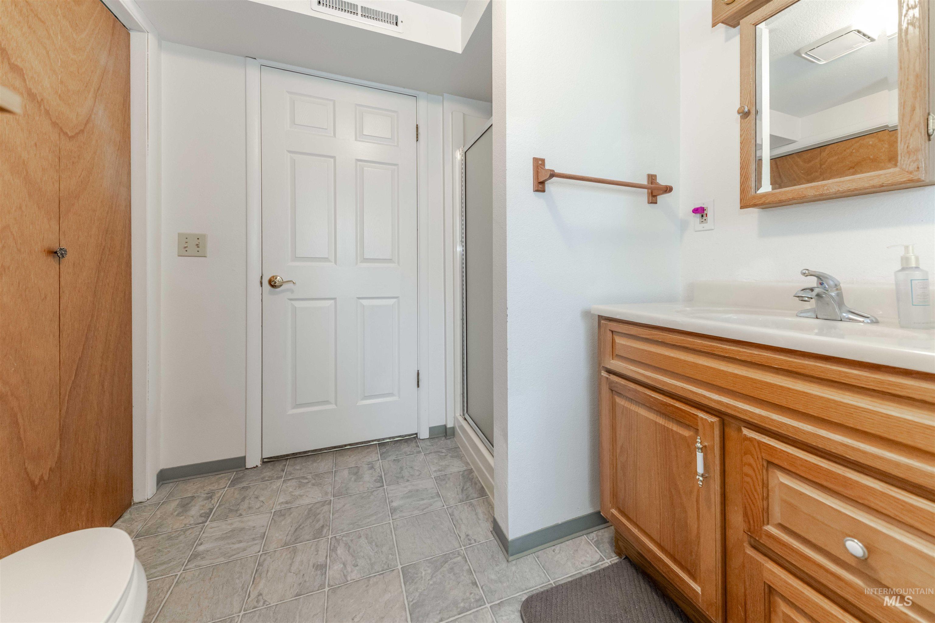 930 Preston Avenue Lewiston, ID 83501 - Photo 21 of 32 Full bathroom featuring vanity and a shower stall