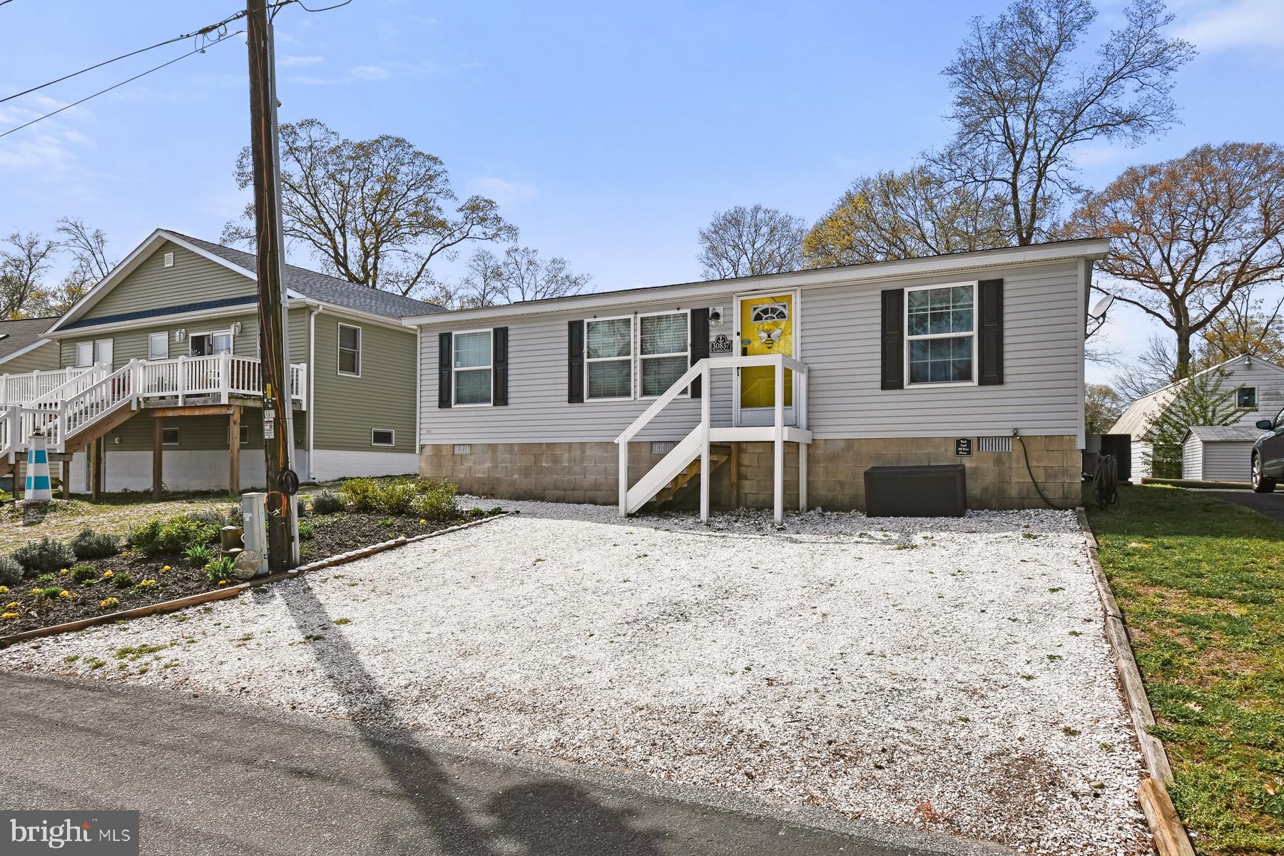 a view of a house with a yard covered in snow