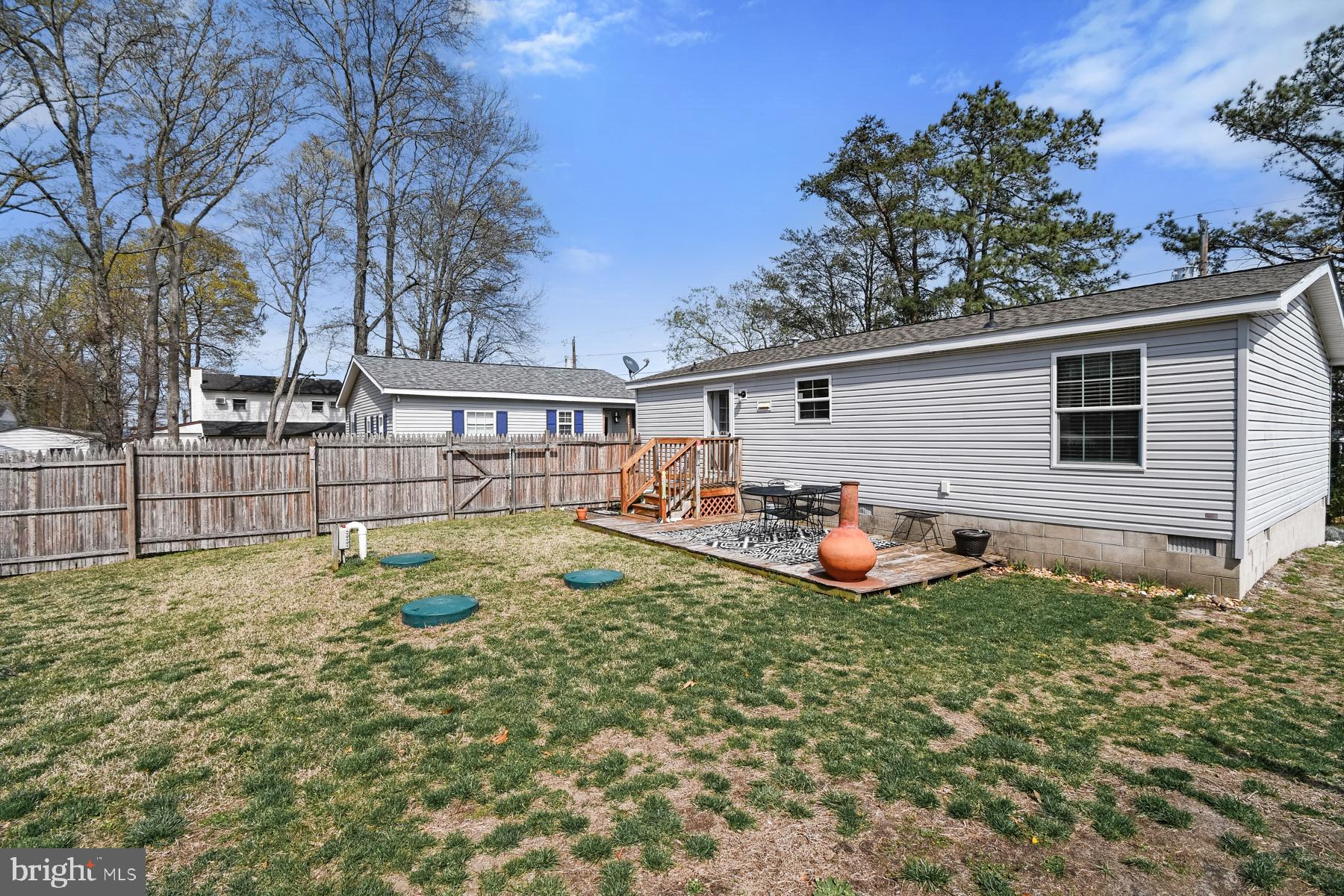 30837 West Lagoon Road Dagsboro, DE 19939 - Photo 11 of 42 a view of a house with backyard and sitting area