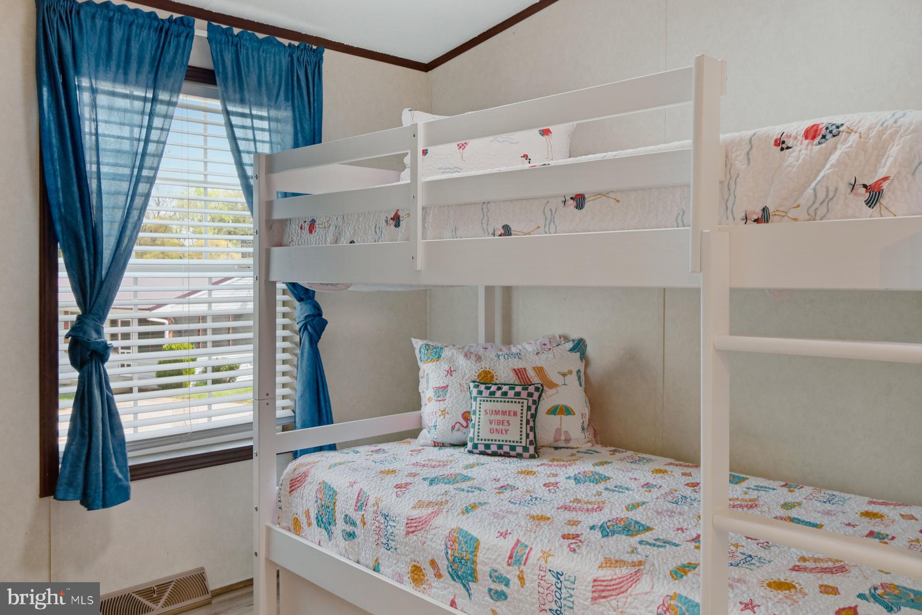 30837 West Lagoon Road Dagsboro, DE 19939 - Photo 32 of 42 a bedroom with a bed and a window