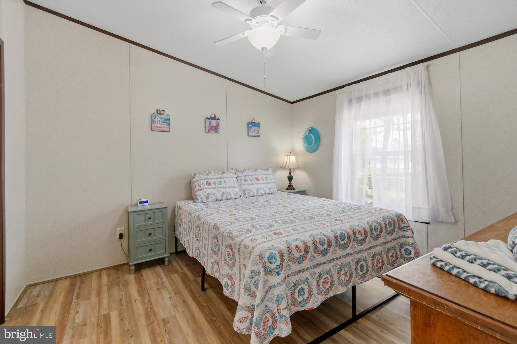 30837 West Lagoon Road Dagsboro, DE 19939 - Photo 37 of 42 a bedroom with a bed and a window