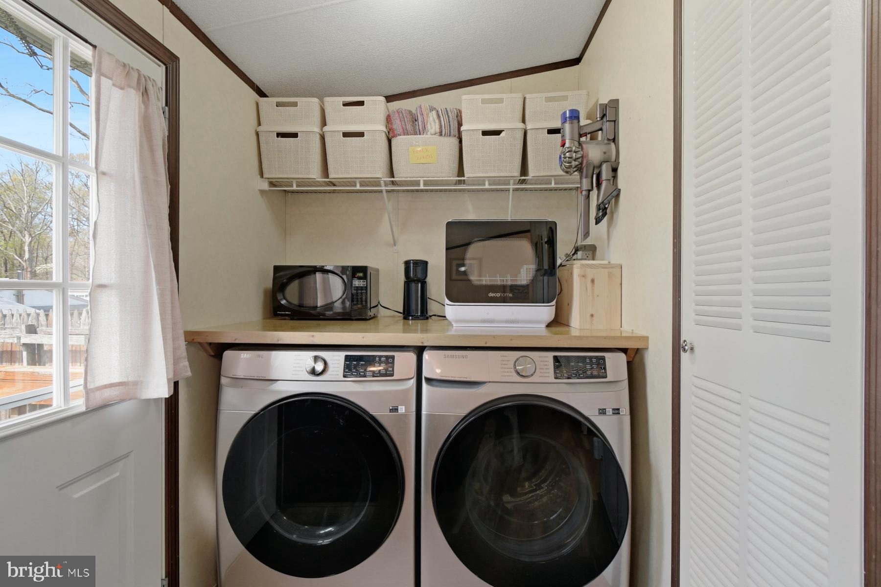 30837 West Lagoon Road Dagsboro, DE 19939 - Photo 42 of 42 a close up view of a washer and dryer
