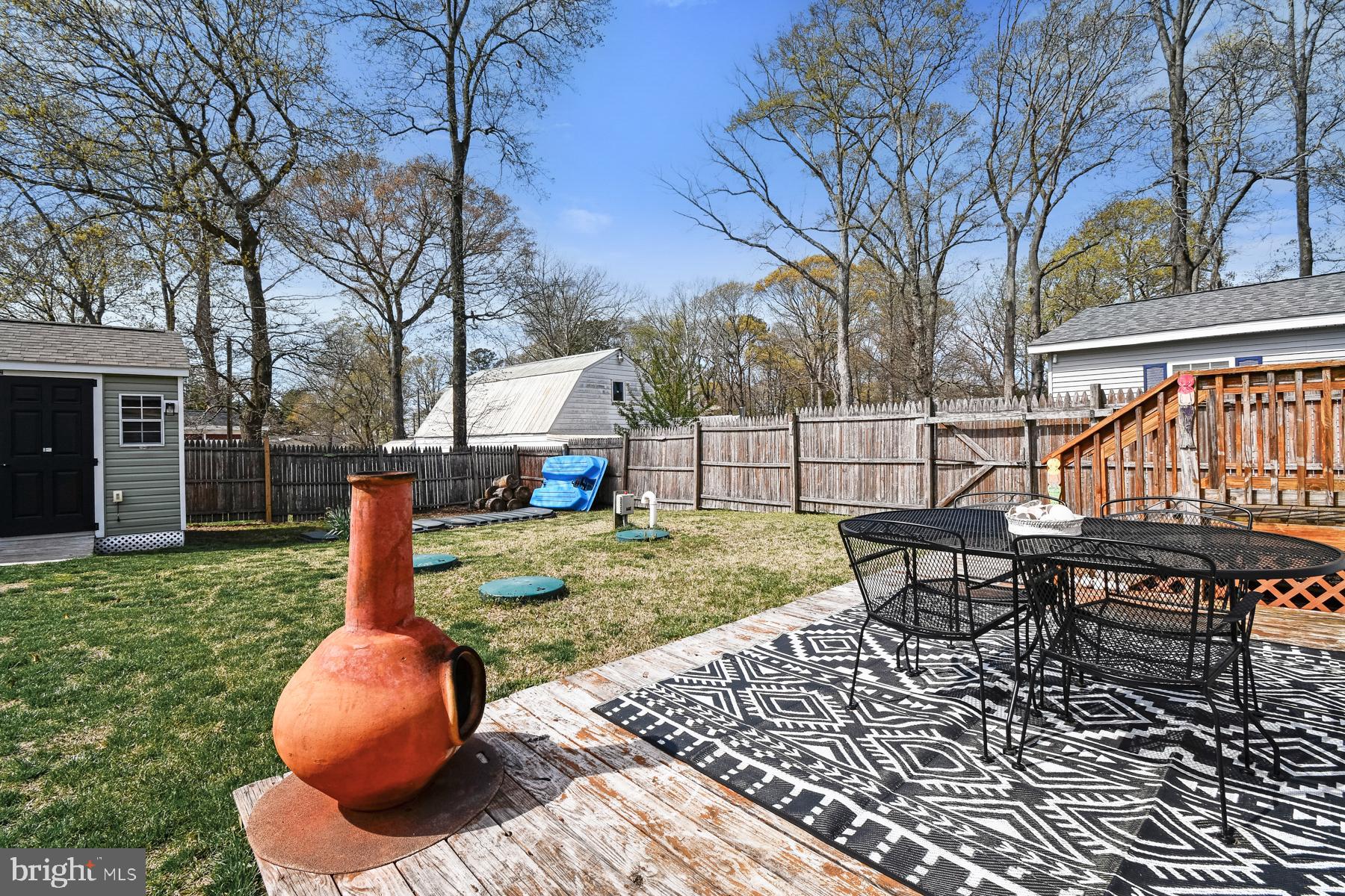 30837 West Lagoon Road Dagsboro, DE 19939 - Photo 9 of 42 a backyard of a house with table and chairs