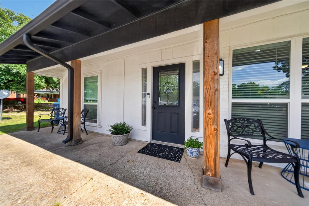 614 Colonial Drive Athens, TX 75751 - Photo 2 of 26 a view of a porch with chairs and backyard