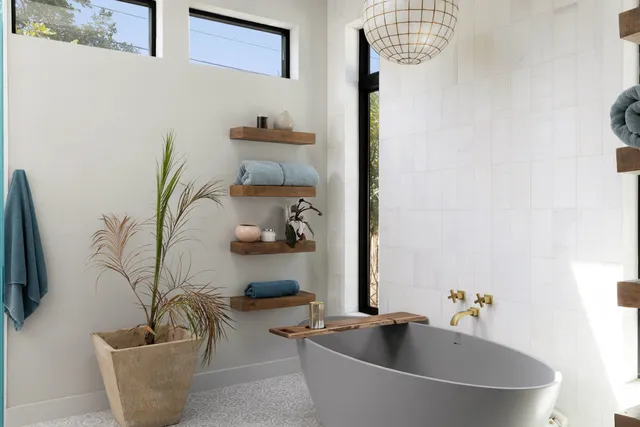 a bathroom with a bathtub and sink